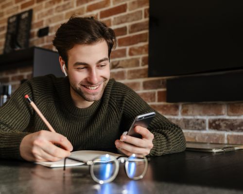 man paying convergent billing apartment rent